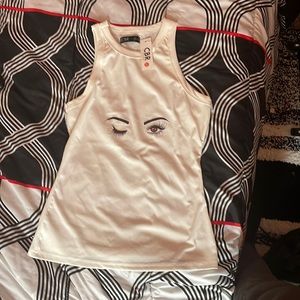 White tank top with black drawing on it with no sleeves on it && good material .